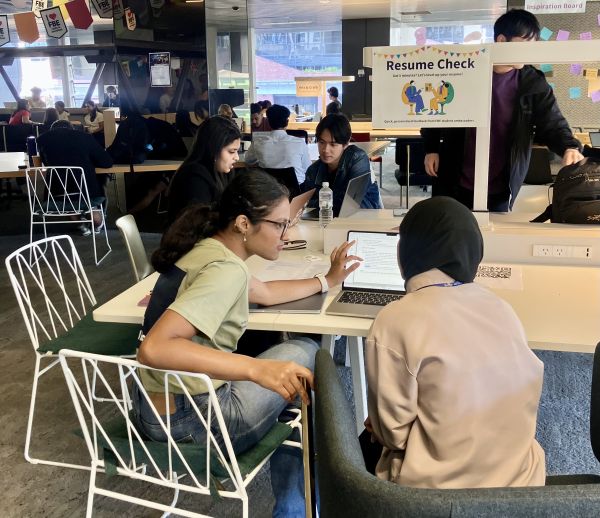 Students at the resume check station
