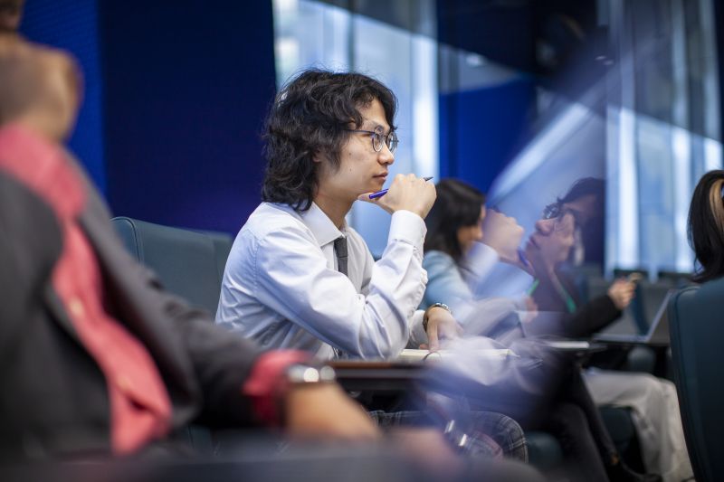 Student looking curious in lecture hall