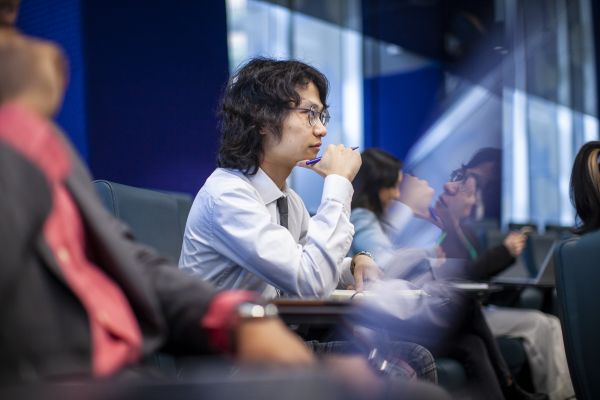 Student looking curious in lecture hall