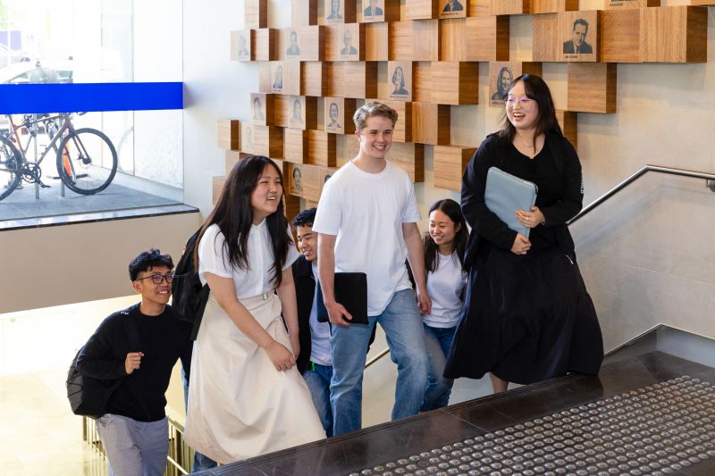 A group of students walking up the stairs in the Spot building